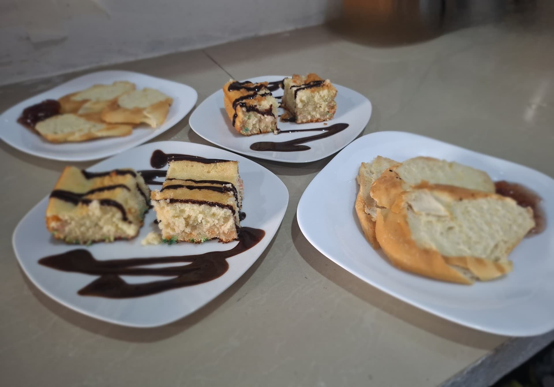 Selection of homemade cakes and pastries with chocolate sauce at Hotel Serendipity