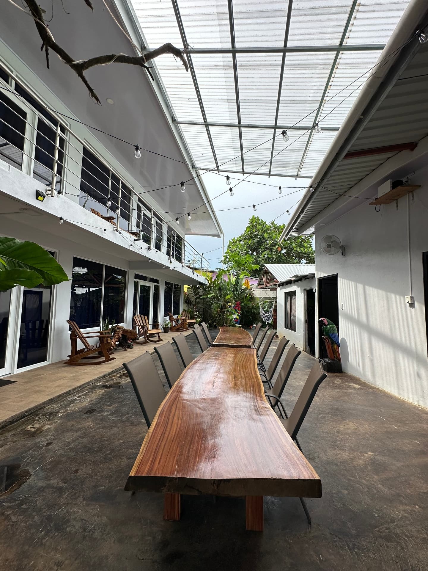 Live-edge wood dining table set for a meal in the courtyard